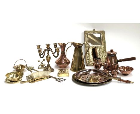 A mixed lot of brass and copper items to include Art Nouveau style crumb sweep, brass four arm candlestick, J. S &amp; S Arts