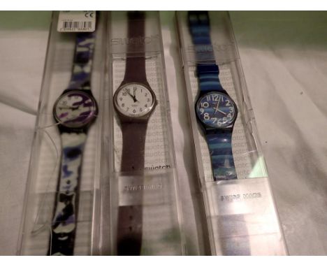 Three Swatch wristwatches. UK P&amp;P Group 1 (£16+VAT for the first lot and £2+VAT for subsequent lots) 