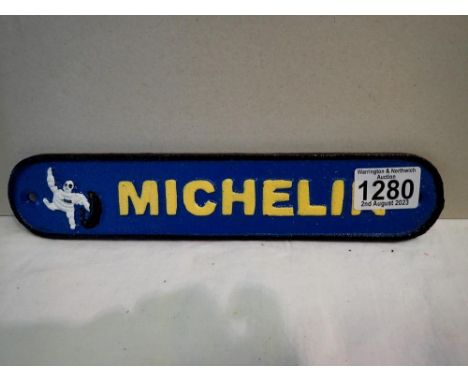 Cast iron Michelin sign, L: 25 cm. UK P&amp;P Group 1 (£16+VAT for the first lot and £2+VAT for subsequent lots) 