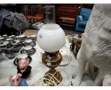 Paraffin lamp converted to electric with shade and chimney. All electrical items in this lot have been PAT tested for safety 