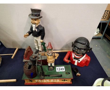 Three cast iron automaton moneyboxes trick dog, american president and another, one damaged. Not available for in-house P&amp