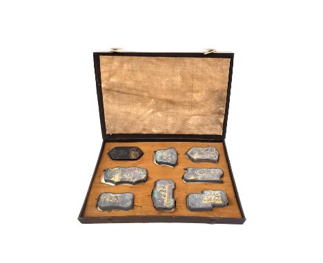 A Chinese calligraphy stone ink block set circa 1900, intricately carved in relief, hand painted and with gilt embellishments