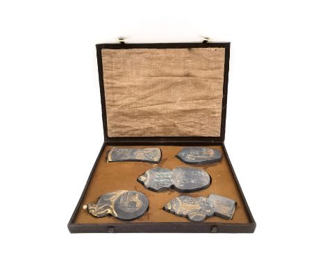 A Chinese calligraphy stone ink block set circa 1900, intricately carved in relief and hand painted with gilt embellishments,