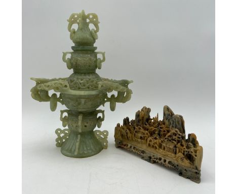 A 20th century Chinese green jade incense burner in three parts having allover pierced and openwork decoration with dragon's 