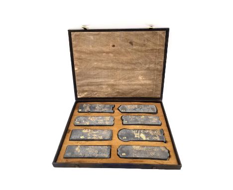 A Chinese calligraphy stone ink block set circa 1900, intricately carved in relief and hand painted with gilt embellishments,