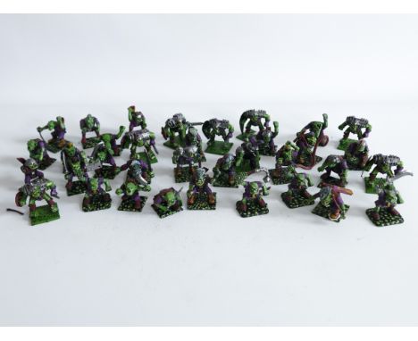 A lot of plastic ORC miniatures for use with WARHAMMER FANTASY BATTLES. Probably 1990's.