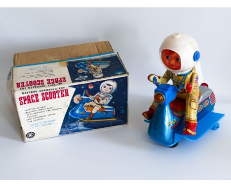 BATTERY OPERATED SPACE SCOOTER made in Japan by MASUDAYA in the 1960's. Comes with tatty original packaging and some damage t