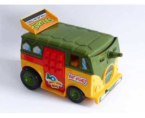 This is a TURTLE WAGON from TEENAGE MUTANT NINJA TURTLES made by PLAYMATES in the 1990's. Missing parts.