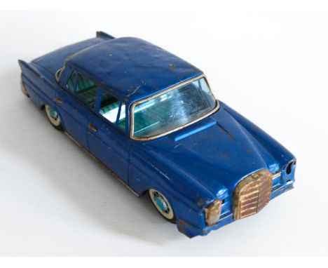 This is a&nbsp;MERCEDES BENZ 220 made in JAPAN by BANDAI in the 1950's / 1960's. It is in well used condition and missing som