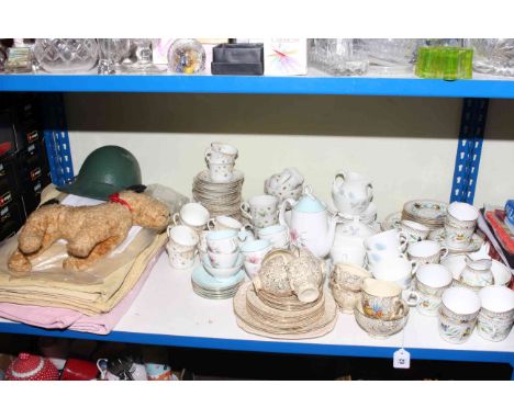 Five part tea services, linen, helmet and soft toy