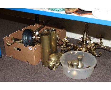 Collection of brassware including light fitting, table lamp, shell cases, candlesticks, etc