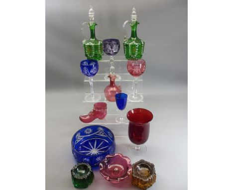 COLOURFUL GLASSWARE GROUP to include two green glass Victorian decanters with stoppers and enamel dot decoration, three items