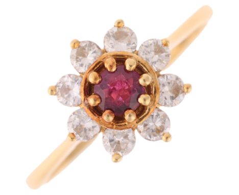 An 18ct gold ruby and diamond flowerhead cluster ring, set with round-cut ruby and modern round brilliant-cut diamonds, total