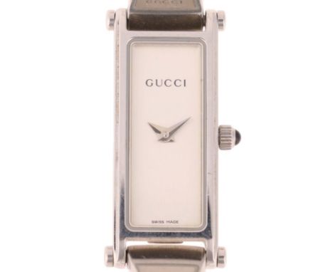 GUCCI - a lady's stainless steel 1500L quartz bangle watch, circa 2000, silvered dial with dauphine hands, cabochon crown and