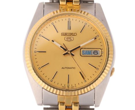 SEIKO 5 - a gold plated stainless steel automatic day/date bracelet watch, ref. 7009-3110, champagne dial with applied baton 