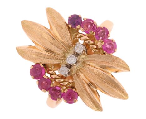 A Continental 18ct gold ruby and diamond cocktail ring, set with round-cut rubies and diamonds, unmarked mount tests as 18ct 