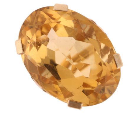 A large 9ct gold citrine dress ring, set with oval mixed-cut citrine, setting height 27.2mm, size L, 14.2g . Condition Report