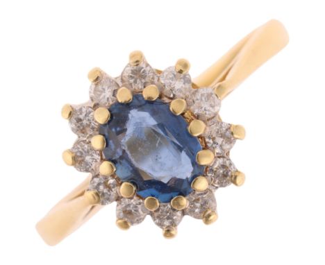 An 18ct gold sapphire and diamond oval cluster ring, maker GJ, Birmingham 1987, set with oval mixed-cut sapphire and modern r
