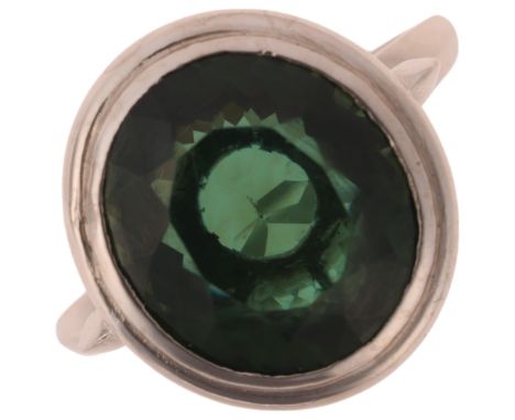 A platinum prasiolite dress ring, rub-over set with oval mixed-cut prasiolite, setting height 16.4mm, size N, 6g . Condition 