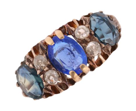 An 18ct gold seven stone sapphire and diamond half hoop ring, centrally set with oval mixed-cut corundum doublet, flanked by 