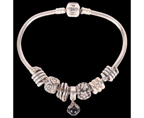 PANDORA - a sterling silver snake link charm bracelet, with 7 silver charms, 18cm, 35.7g . Condition Report:No damage or repa