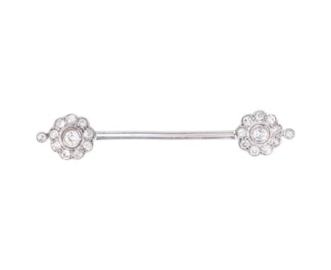 An Antique 18ct white gold diamond flowerhead cluster bar brooch, circa 1910, each flowerhead set with central old European-c