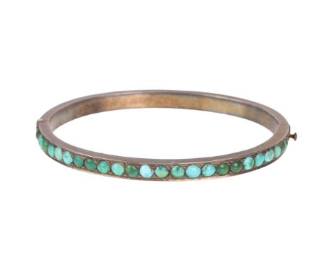 A Victorian silver turquoise hinged bangle, band width 4.6mm, internal circumference 15cm, 17.4g . Condition Report:1 turquoi