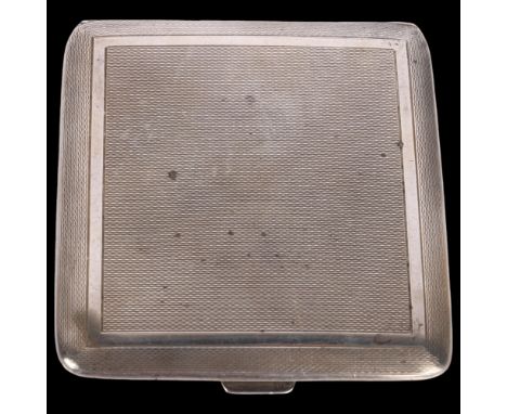 A George VI square silver cigarette case, Duncan & Scobbie, Birmingham 1947, allover engine turned decoration with gilt inter