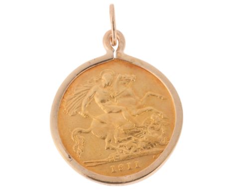 A George V 1911 gold half sovereign coin, in 9ct gold pendant mount, 20.3mm, 4.8g . Condition Report:General wear to high poi