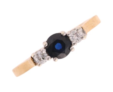A 9ct gold three stone sapphire and diamond ring, setting height 4.7mm, size M, 2.1g . Condition Report:No damage or repair, 