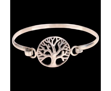 A modern sterling silver 'Tree' torque bangle, setting height 21.3mm, internal circumference 16cm, 10.6g . Condition Report:N