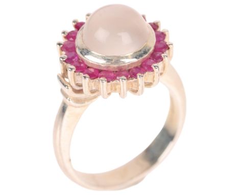 A sterling silver moonstone and ruby cluster ring, setting height 15.3mm, size N, 6.8g . Condition Report:No damage or repair