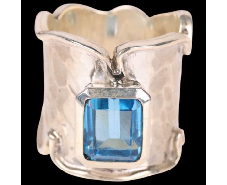 A sterling silver blue topaz band ring, setting height 21.7mm, size N, 14.4g . Condition Report:No damage or repair