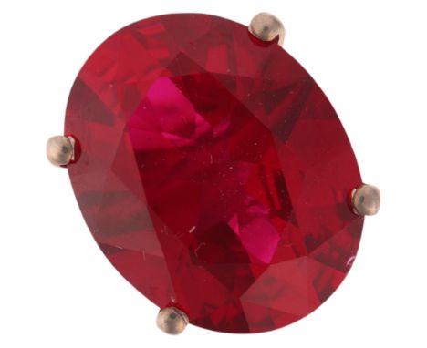 A 9ct white gold single stone synthetic ruby dress ring, claw set with oval mixed-cut ruby, setting height 17.1mm, size O, 5.