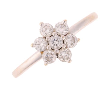 A 9ct white gold diamond flowerhead cluster ring, maker GMC, London 2016, set with modern round brilliant-cut diamonds, total
