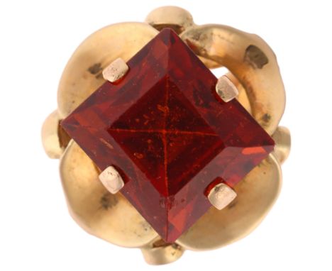 A 9ct gold orange hessonite garnet dress ring, set with rectangular step-cut garnet, unmarked mount tests as 9ct gold, settin