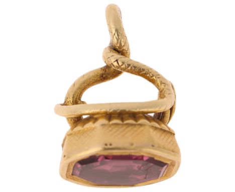 An Antique Victorian 15ct gold pink spinel 'Snake' fob, set with foil-back octagonal step-cut pink spinel within coiled snake