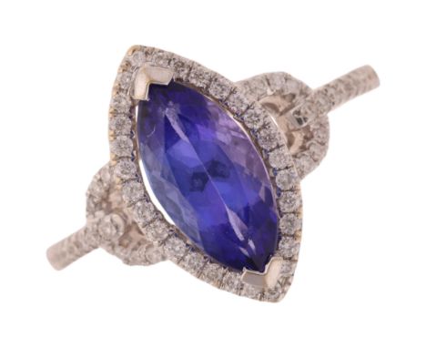 An 18ct white gold tanzanite and diamond marquise halo cluster ring, set with 1.68ct marquise-cut triple AAA tanzanite, surro