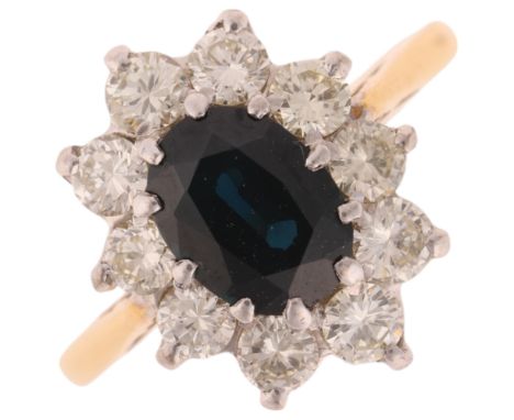 An 18ct gold sapphire and diamond flowerhead cluster ring, set with oval mixed-cut sapphire and modern round brilliant-cut di