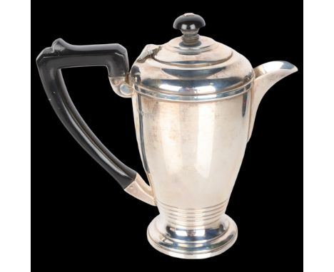 A George VI Art Deco silver hot water jug, Roberts & Dore Ltd, Birmingham 1938, cylindrical form with Bakelite mounts, 19cm, 