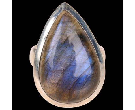A sterling silver labradorite dress ring, set with pear cabochon labradorite, setting height 28.8mm, size P, 12.8g . Conditio