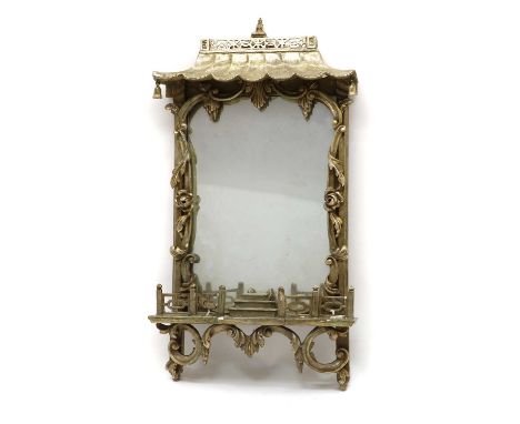 A Chippendale style giltwood mirror,circa 1920s, with rich chinoiserie decoration, modelled as a temple archway, with a scrol