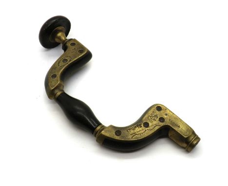 A brass mounted ebony Carpenter's brace by William Marples, with Royal Seller's Patent stamps and makers name, 34cm longLoose