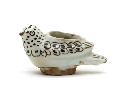 A glazed ceramic water dropper or oil lamp,19th century, probably Persian, in the form of a bird with underglaze painted deco