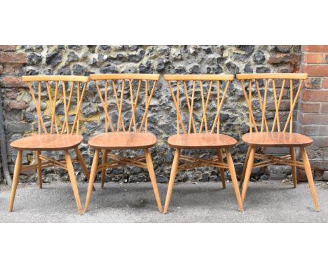 A set of four Ercol candlestick back dining chairs, in light beech and elm, on tapering legs joined by X-cross stretchers, 78