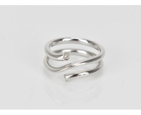 Georg Jensen- An 18ct white gold and diamond 'magic' ring, designed by Regitze Overgaard, with a diamond on each end of the l