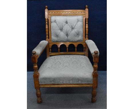 A Victorian oak Gothic Revival armchair by Gillows, possibly designed by Bruce J Talbert (1838-1881) for Gillow &amp; Co, wit