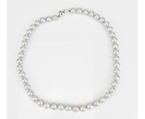 An 18ct white gold and single strand cultured Tahitian pearl necklace, of light grey colour, approximately same sized, with h