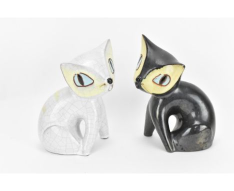 A pair of mid-century ceramic cats by Leopold Anzengruber, Vienna Austria, one in black glaze, the other in crackled white gl