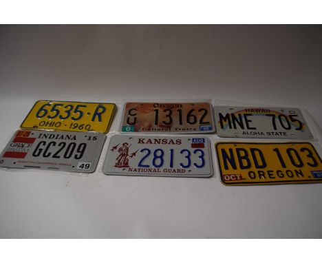 Five various American number plates